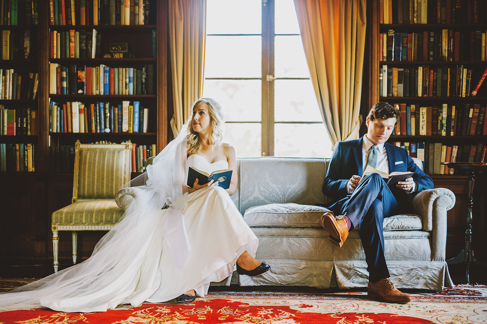 Bride and groom reading books in the library | Portland Town Club Wedding