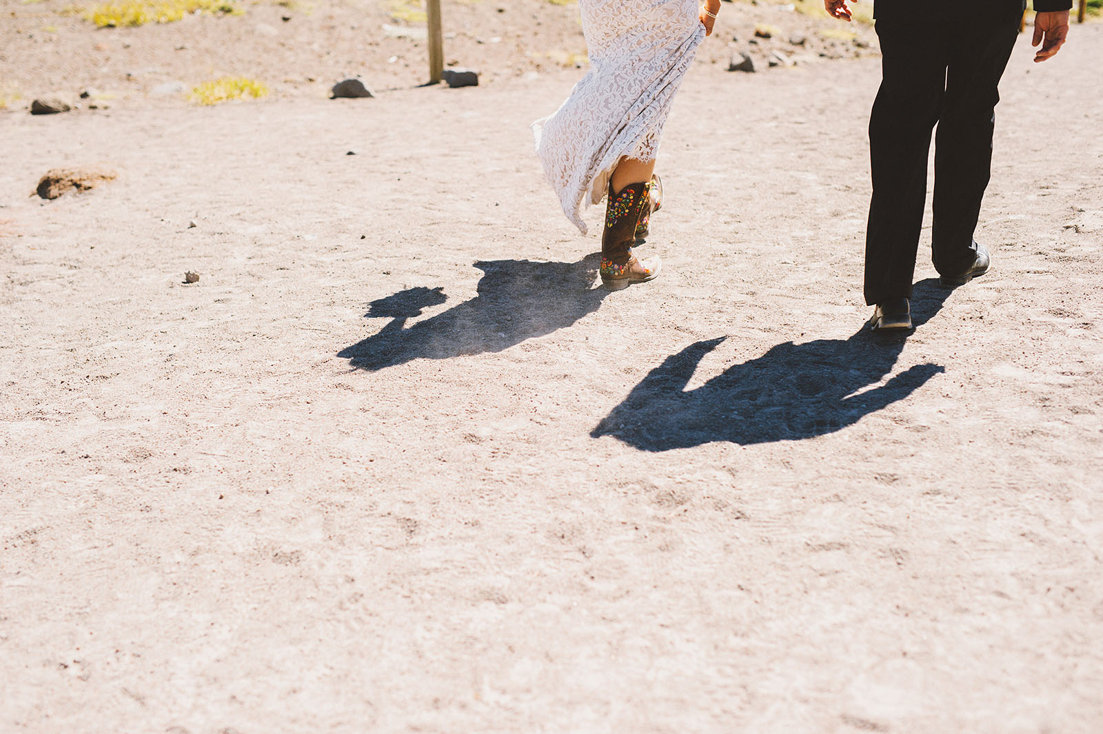 Bride wearing cowboy boots | Mazama Lodge Wedding