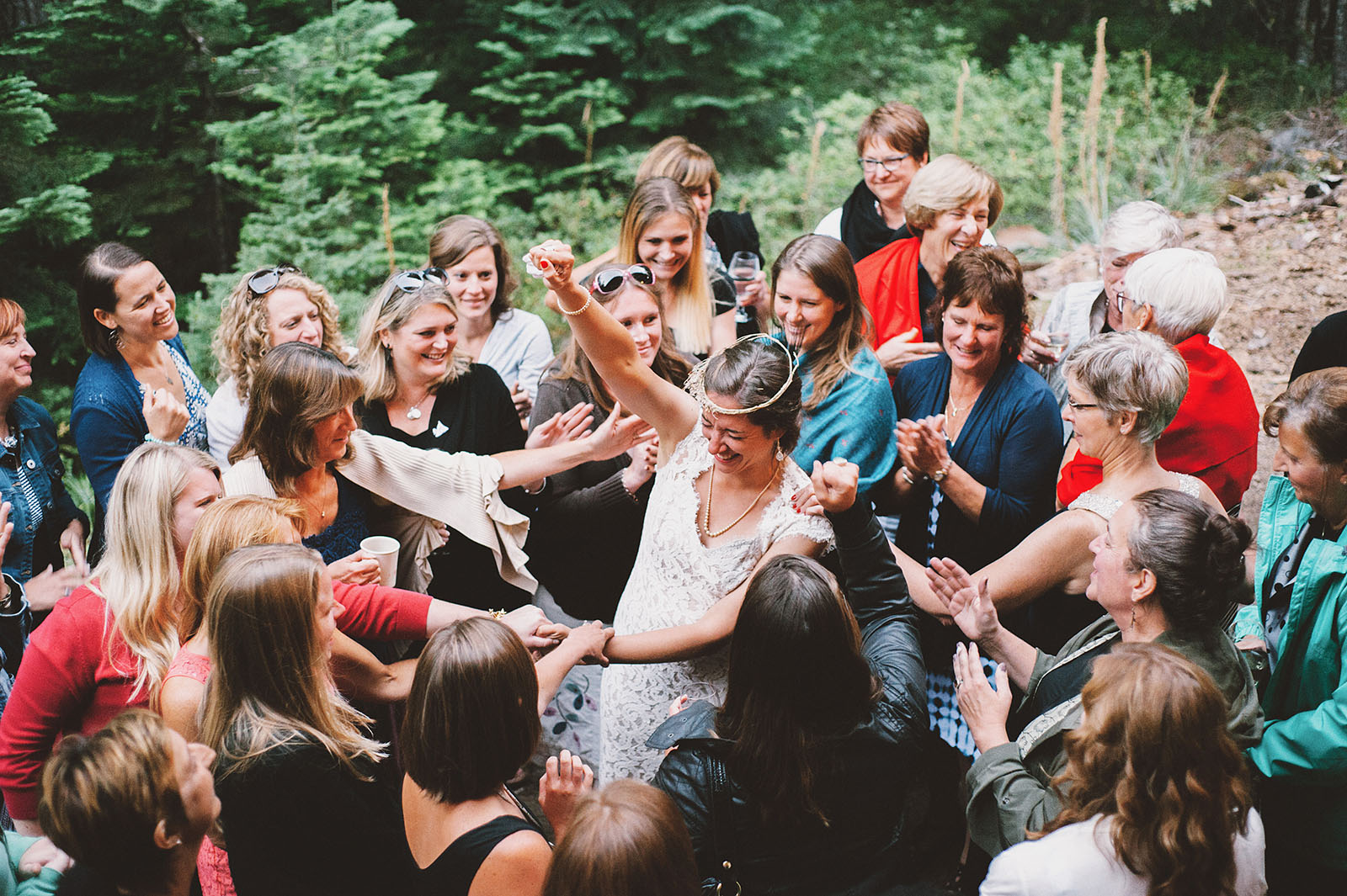 Bride huddling with all of her ladies | Mazama Lodge Wedding