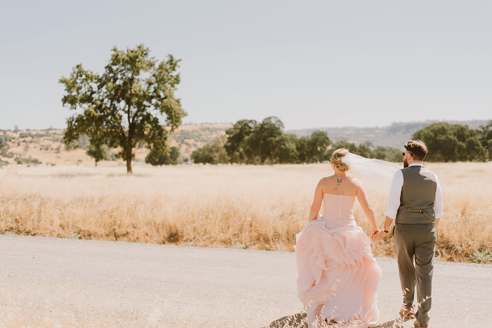 Bride and Groom walking through Upper Bidwell Park | Backyard Chico California Wedding