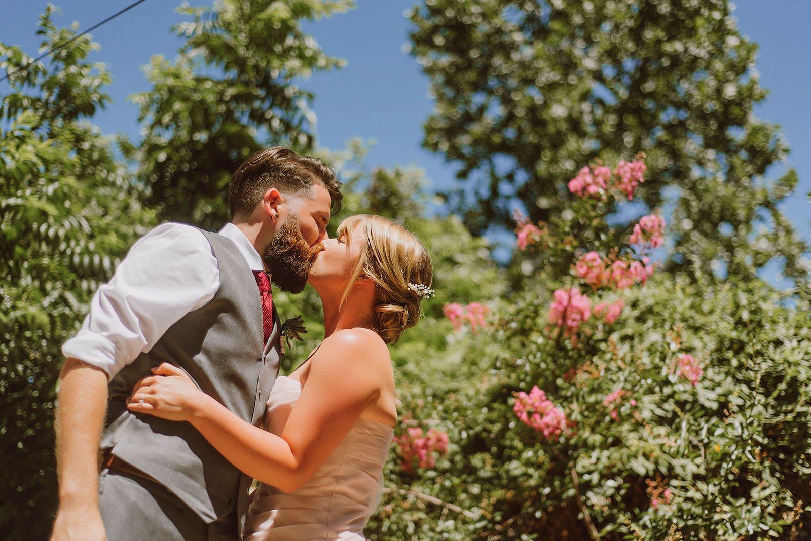Bride and Groom kissing | Backyard Chico California Wedding