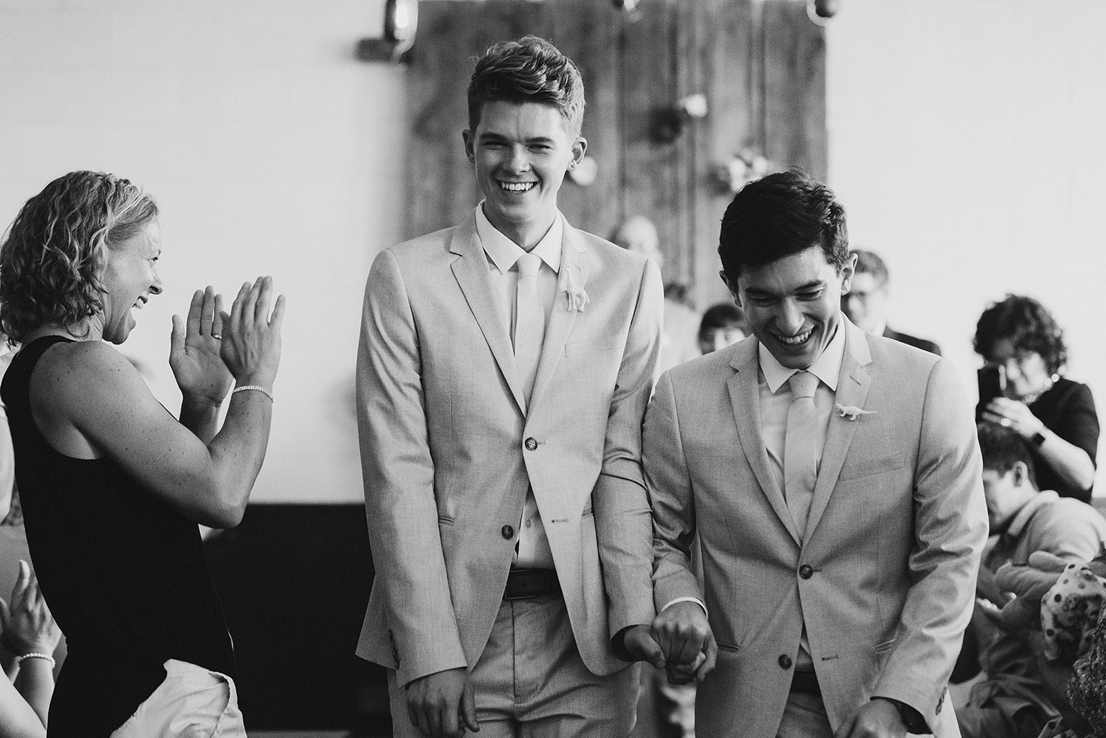 Grooms walking down the aisle together after their Union Pine wedding ceremony