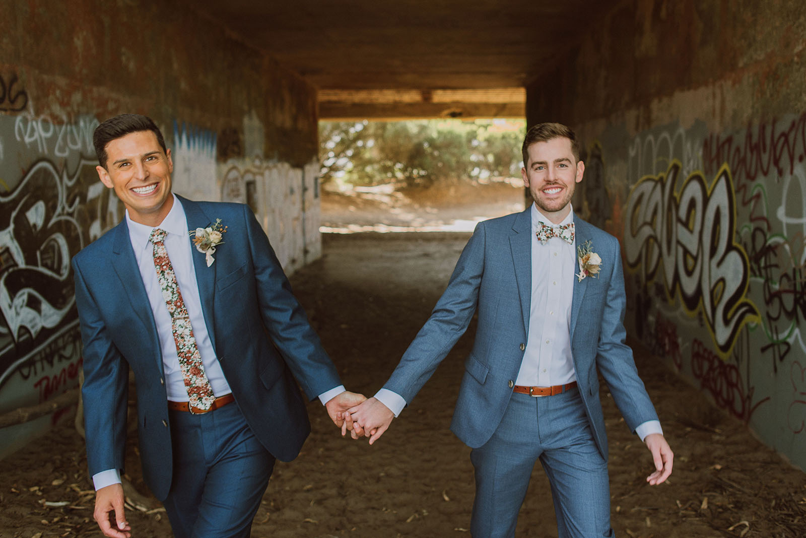 Grooms holding hands at Fort Funston - Foreign Cinema Wedding