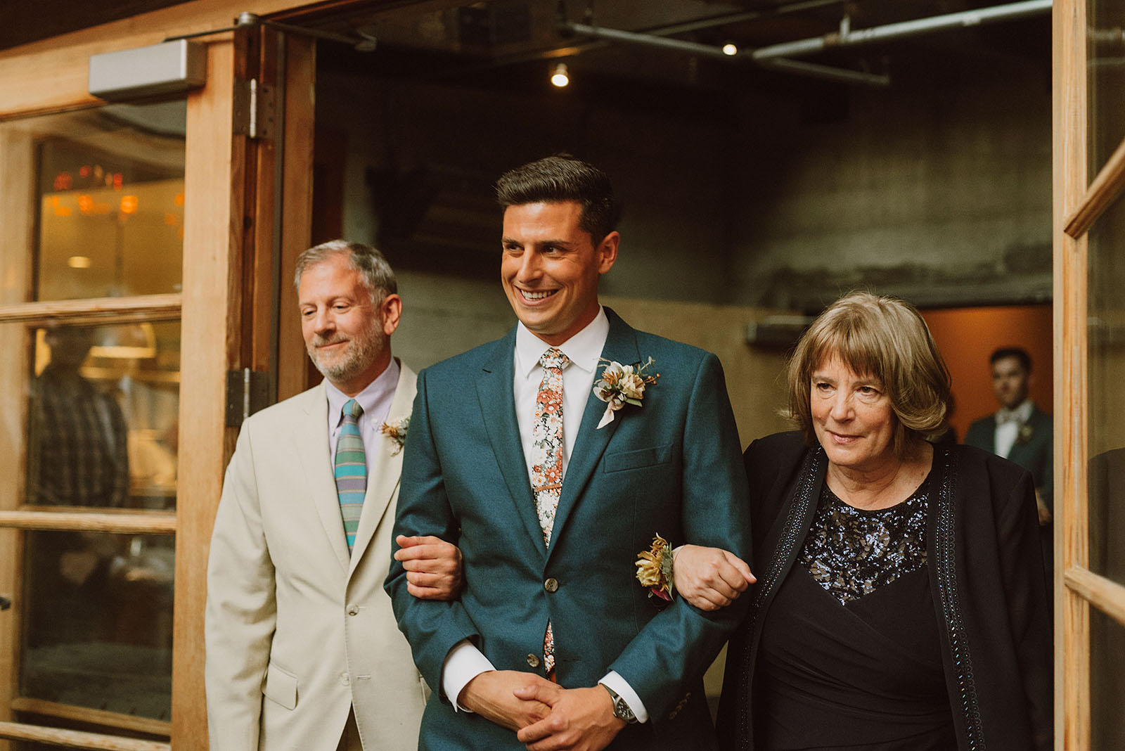 Groom walking down aisle with parents - Foreign Cinema Wedding