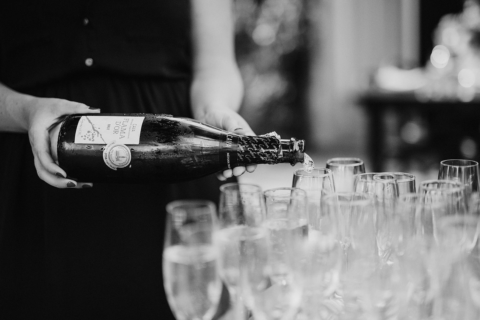 Hosts at Elder Hall pouring champagne at an intimate Ned Ludd wedding