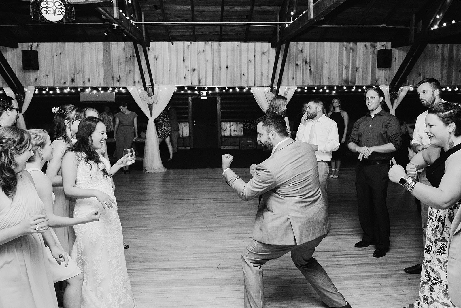 Bride and Groom dueling on the dance floor at their Cedarville Lodge Wedding reception