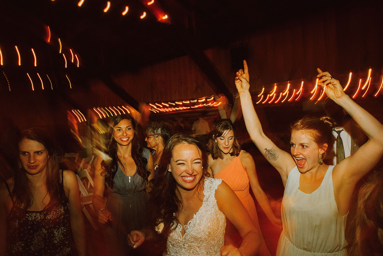 Guests partying on the dance floor at a Cedarville Lodge Wedding reception