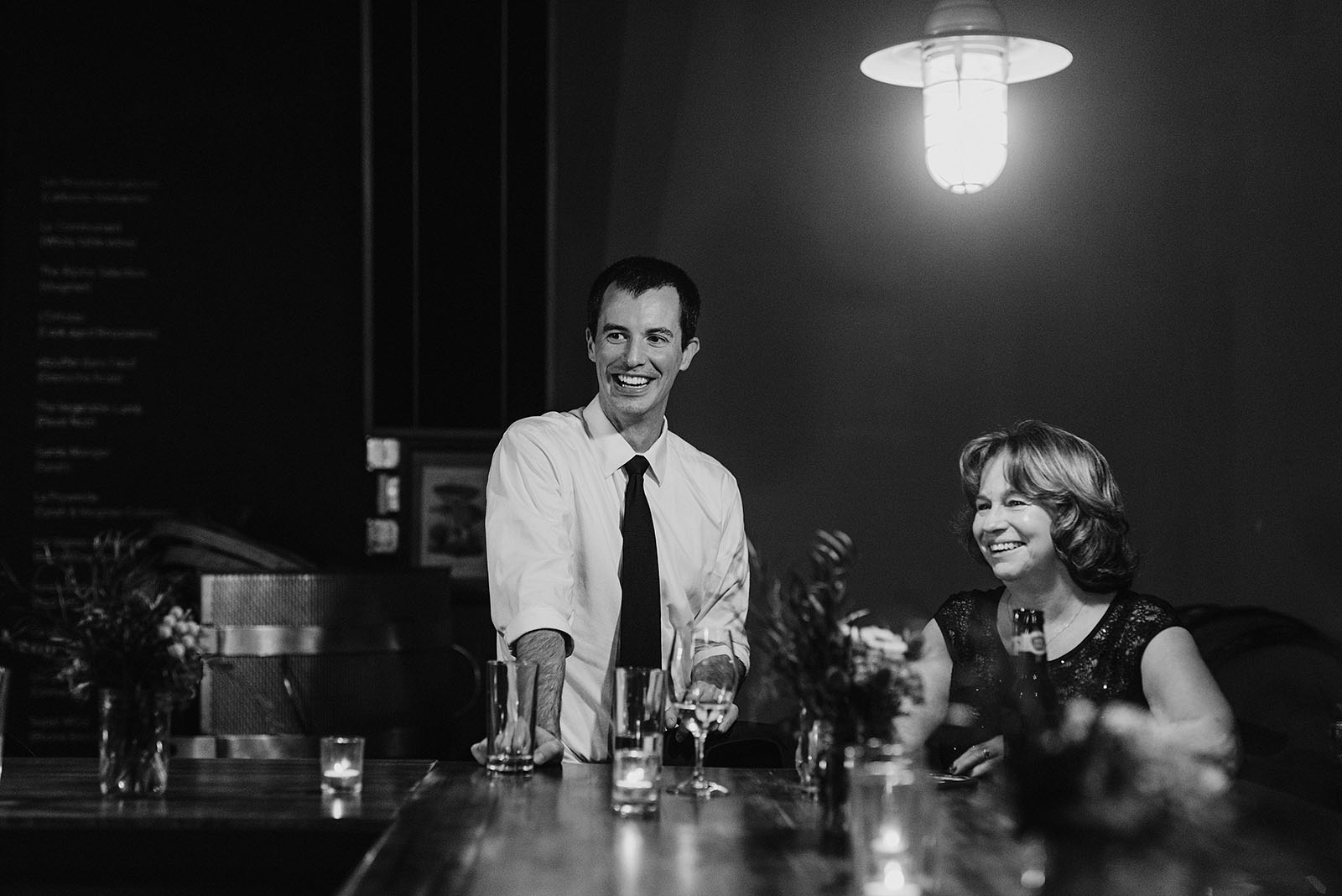 Mother of the groom laughing with guests at an Intimate Restaurant Wedding in Portland, OR