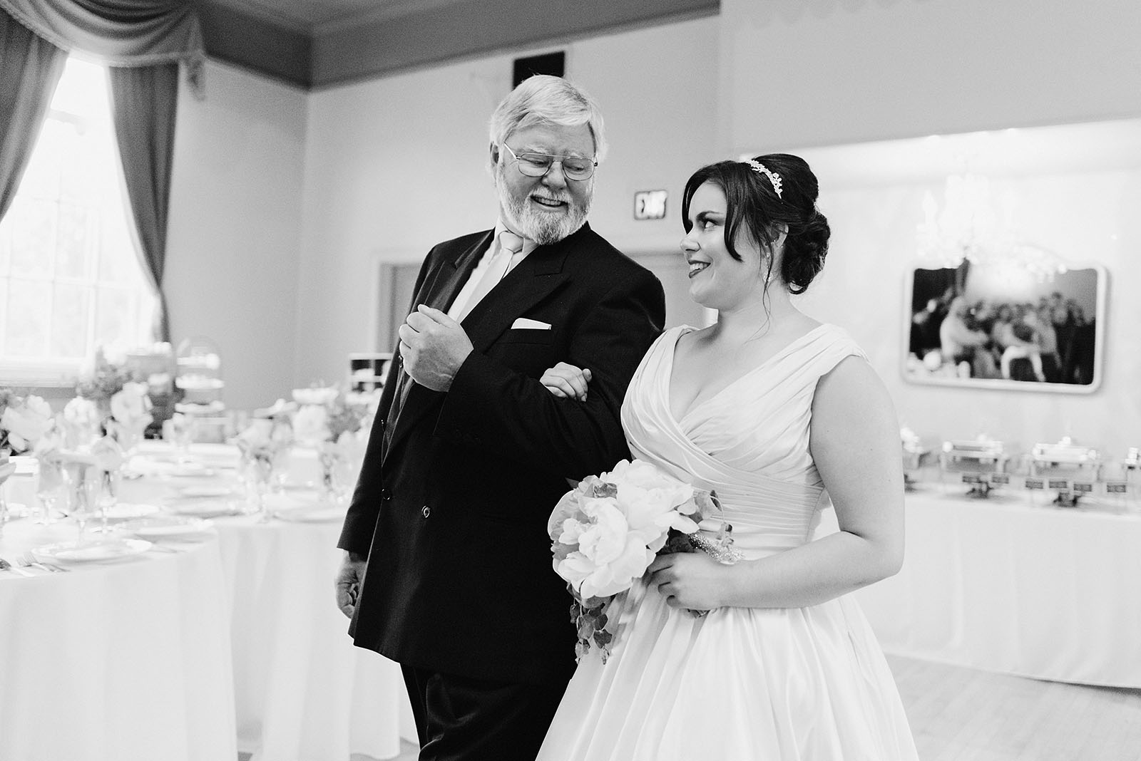 Father of the bride smiling while walking down the aisle - Polaris Hall Wedding