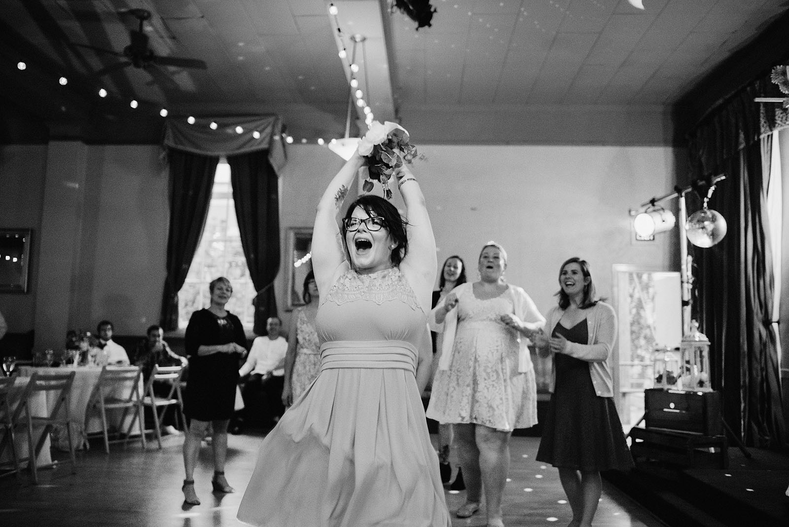Bride's sister catching the bouquet - Polaris Hall Wedding