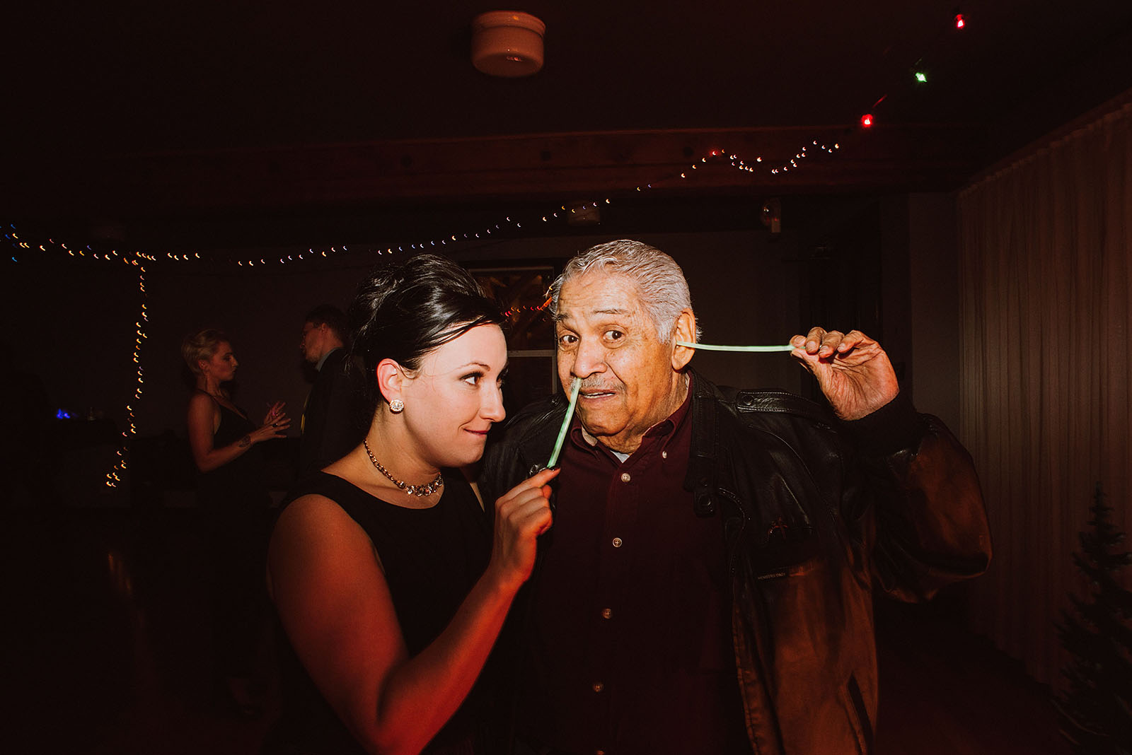Bride and her grandpa playing with glow sticks at The Colony St Johns Wedding